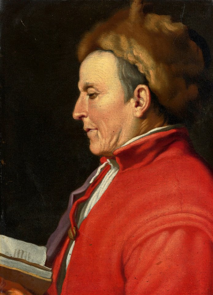 Portrait of a man in a fur hat, reading