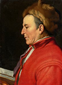 Portrait of a man in a fur hat, reading