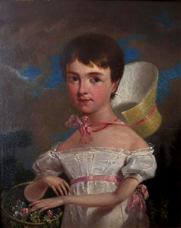 Portrait of an unidentified young girl picking flowers