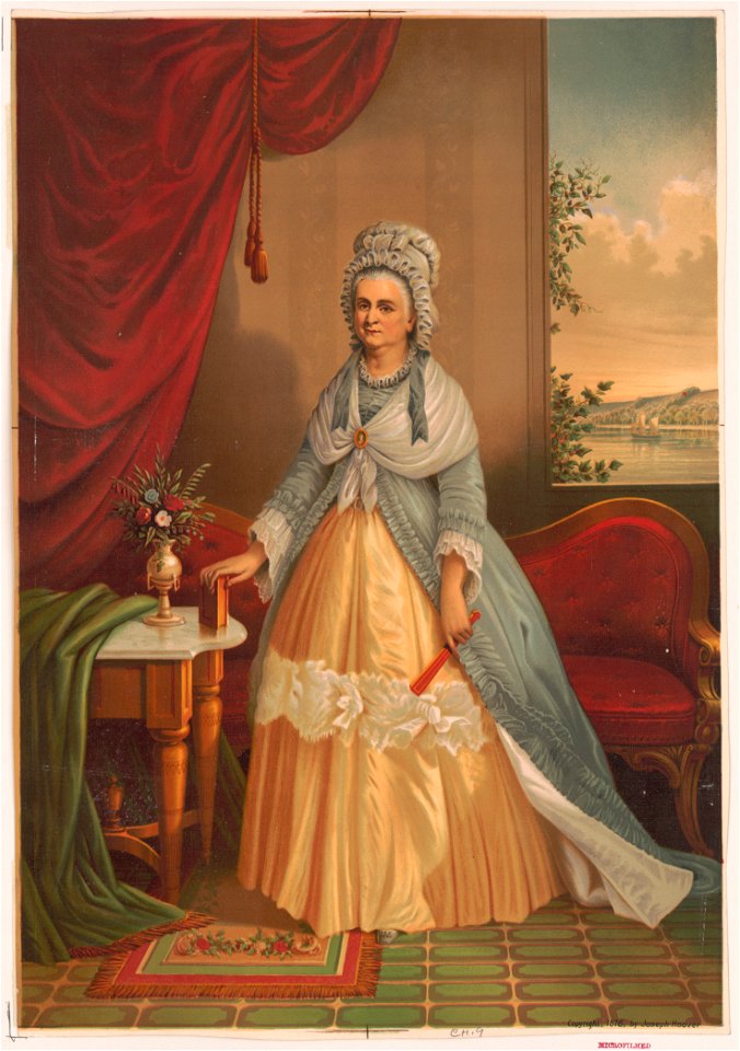Portrait of woman holding fan and book standing in front of couch with background landscape seen through window LCCN2004669687