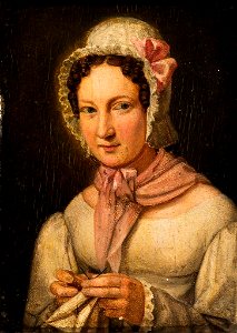 Porträt einer Frau mit Handarbeit