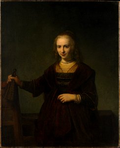 Rembrandt - Portrait of a woman holding a fan and the back of a chair