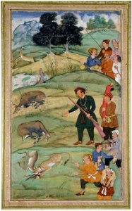 Salim, holding his rifle, gestures at a dead nilgai (6124533009)