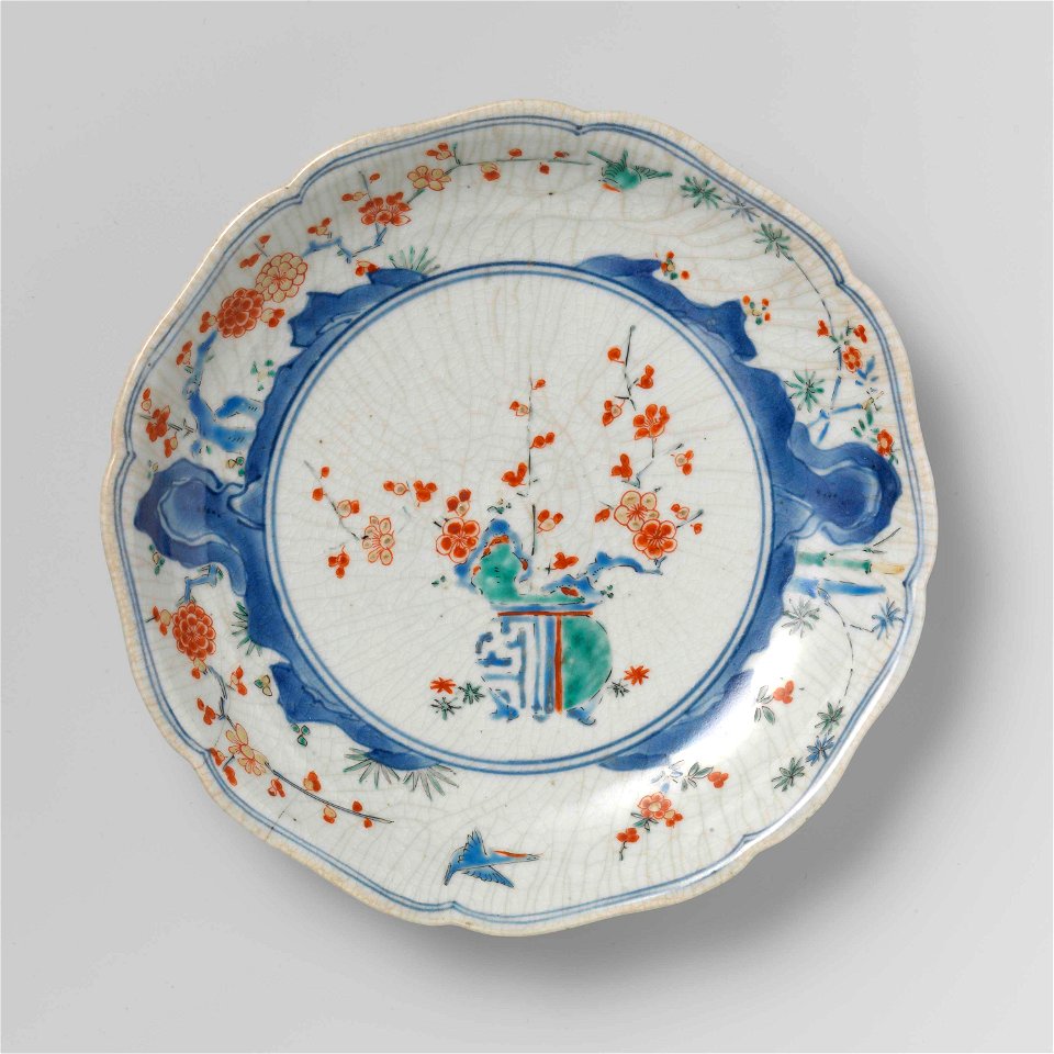 Scalloped dish with flowerpot, rocks, birds, bamboo and prunus