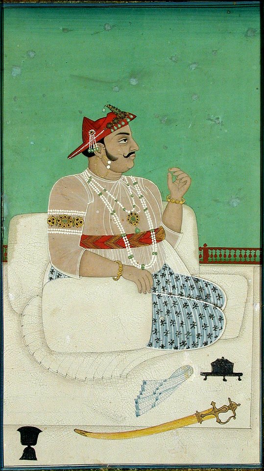 Soma Bhupal Rao of Gadwal seated on a terrace, his sword beside him (6125092660)