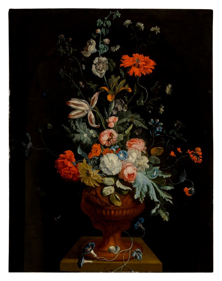 Still life of flowers in a terracotta vase before a stone niche 