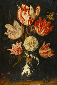 Still life of variegated tulips in a ceramic vase
