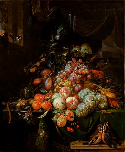 STILL LIFE WITH PLUMS, PEACHES, APRICOTS, GRAPES AND A MELON, WITH A ROEMER GLASS AND A FLUTE GLASS, ALL ON A DRAPED TABLE, A GOLDFINCH ON THE WINDOW SILL AND A BRACE OF SONGBIRDS 