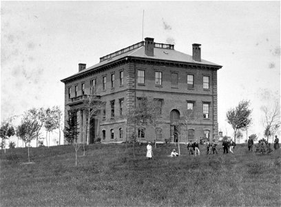 Students standing beside Ballou Hall, c. 1860