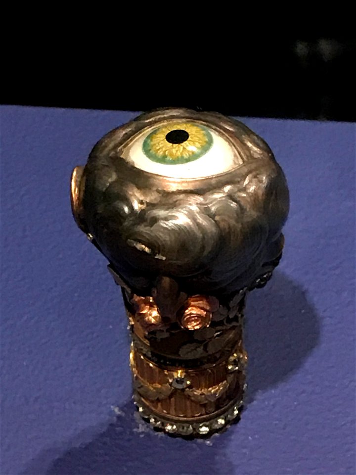 Walking stick knob with enamel eye