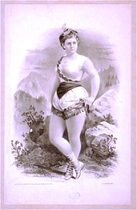 Woman in burlesque costume in front of rocky outcrops LCCN2014635547