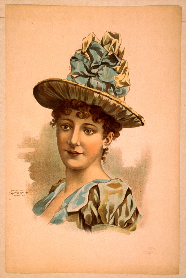 Head-and-shoulders image of brunette woman, facing right, wearing large blue hat LCCN2014636842