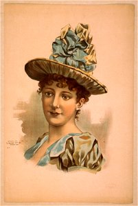 Head-and-shoulders image of brunette woman, facing right, wearing large blue hat LCCN2014636842