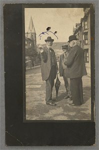 John Gibson chatting to two other men on the street (5349063)