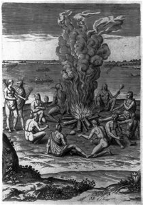 Praying around the fire with rattles LCCN2001696971