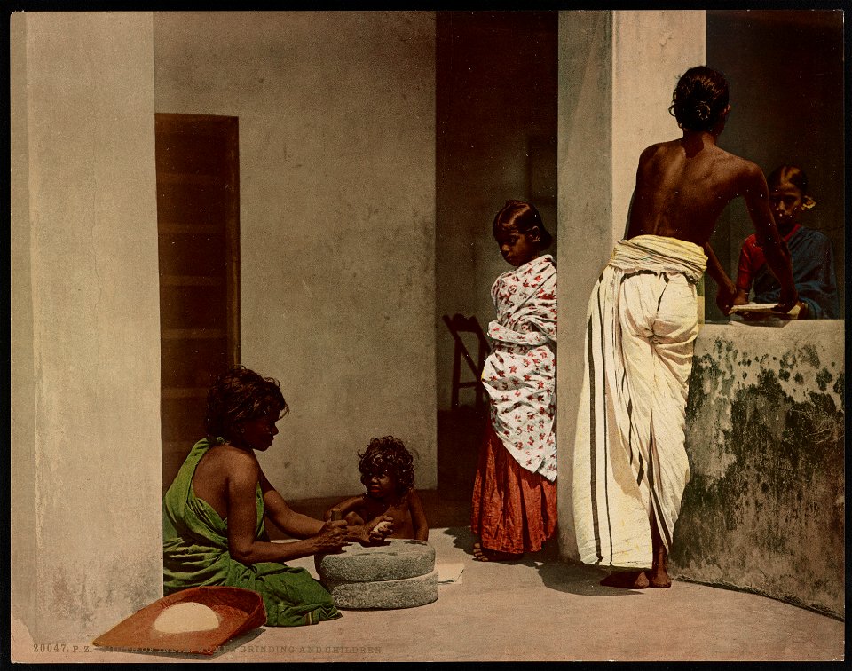 South of India. Women Grinding and Children LCCN2017657625