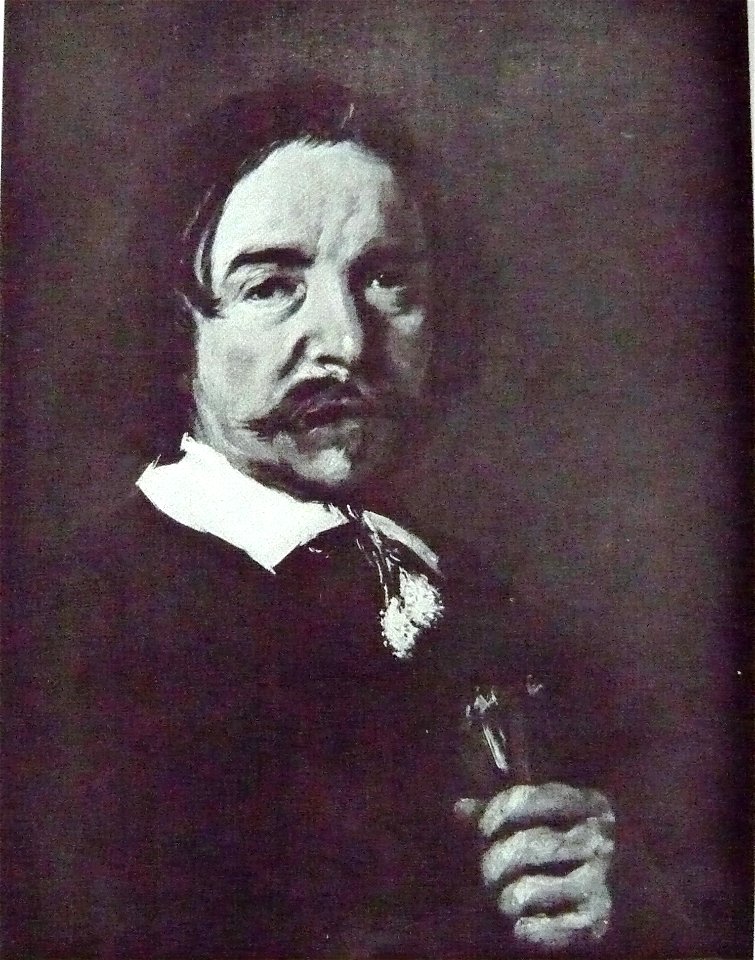 Portrait of a man with a tassle collar holding gloves or flax