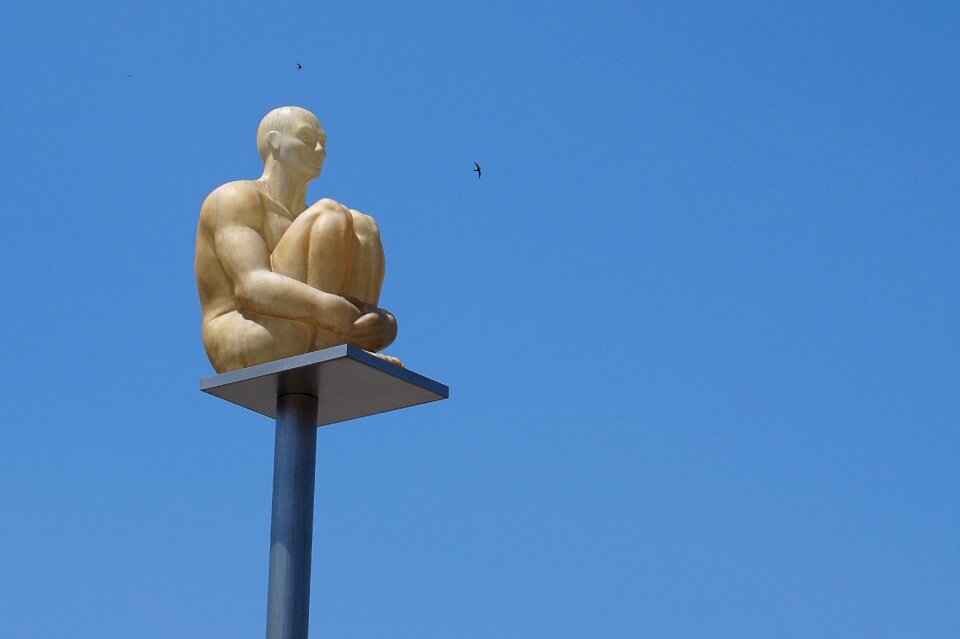 Monument man sitting