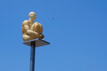 Monument man sitting