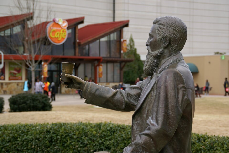 Statue sculpture holding
