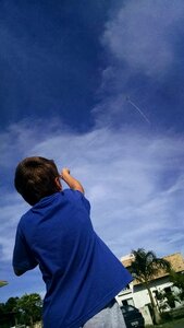 Child playing sky playing with wind