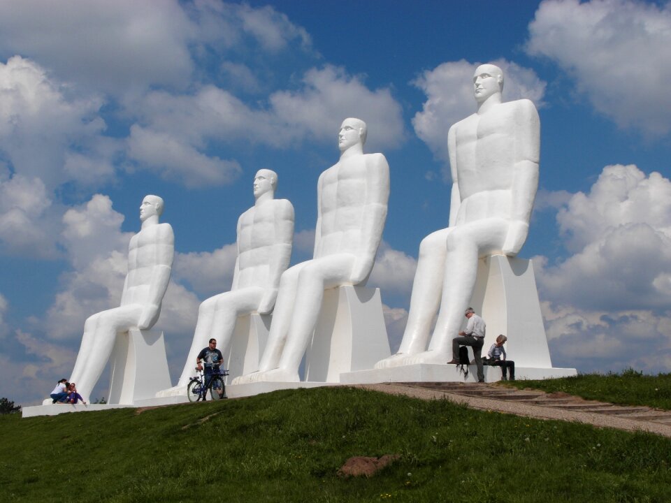 Statues 4 men bicycle