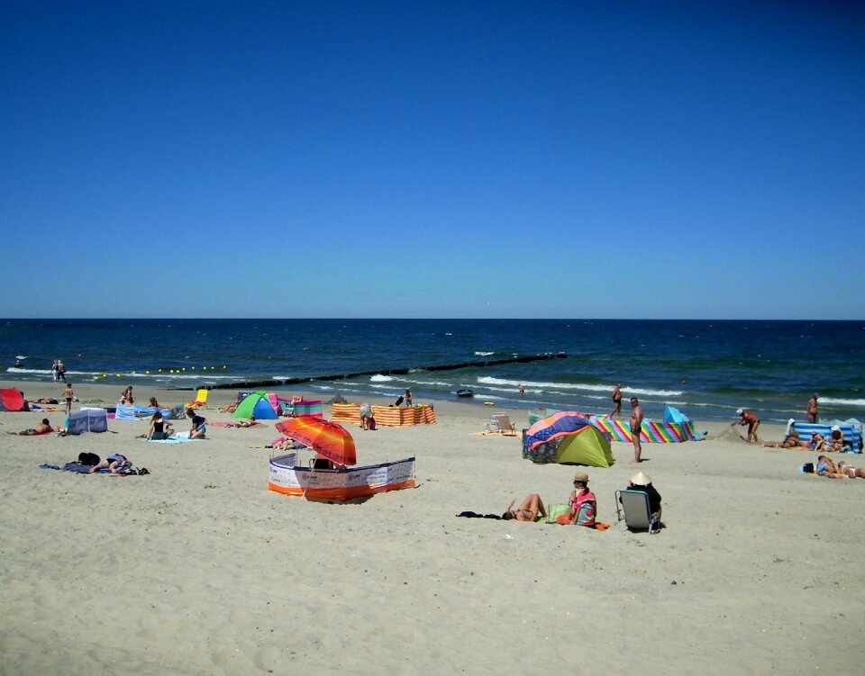 Sea sun worshippers sand
