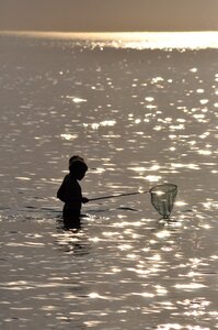 Fishing water sunset photo