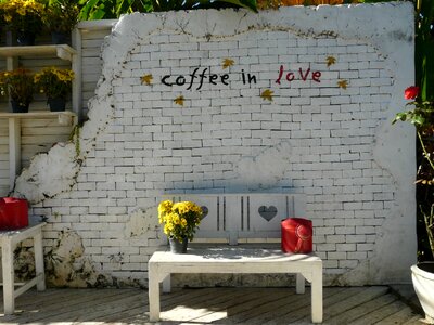 Bench wall watering can photo