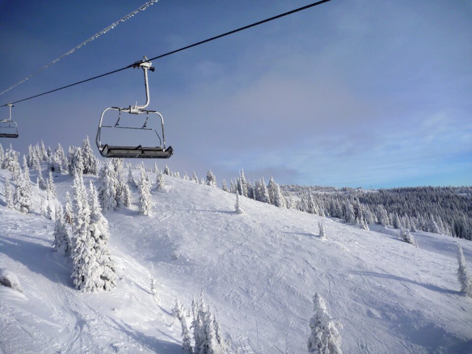 Mountain chair lift snow photo