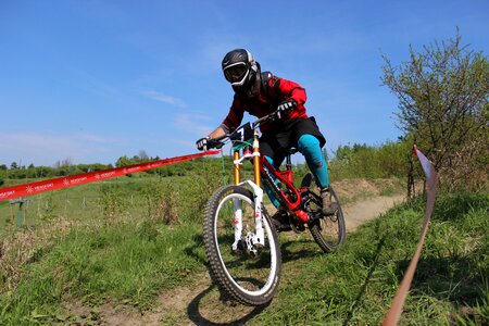 Race cyclist downhill photo