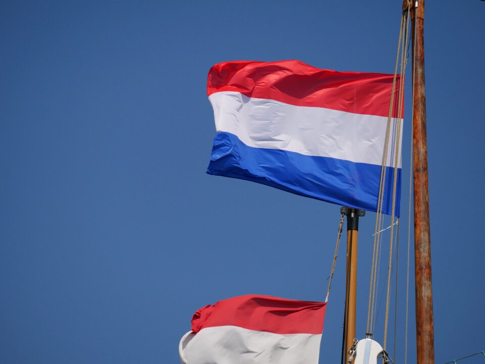 Holland sailing boat waving flag