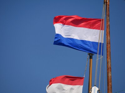 Holland sailing boat waving flag