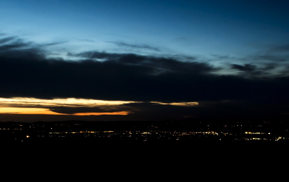 City ​​lights sunset clouds