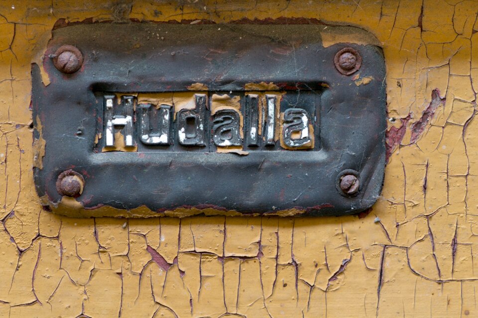 Wood shield front door sign