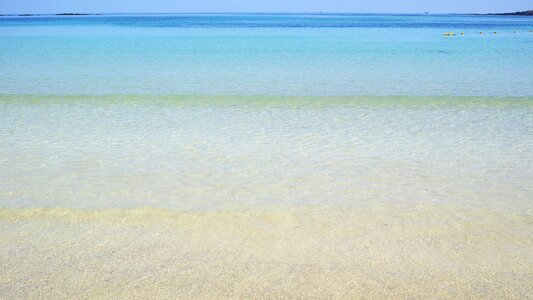 Empty white sand ocean sea photo