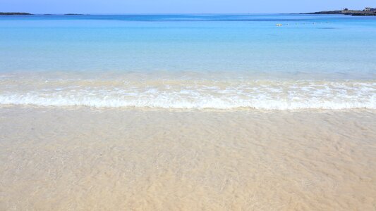 Empty white sand ocean sea photo