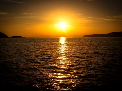 Abendstimmung setting sun sun and sea photo