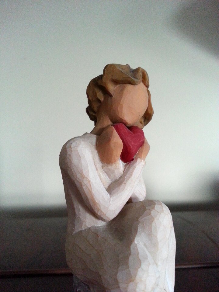 Female figurine heart shape