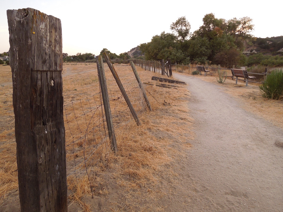 Broken fence post fence