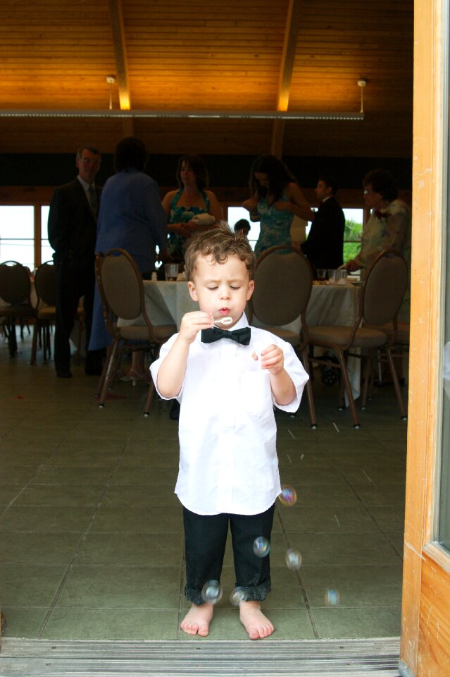Ring bearer toddler blowing