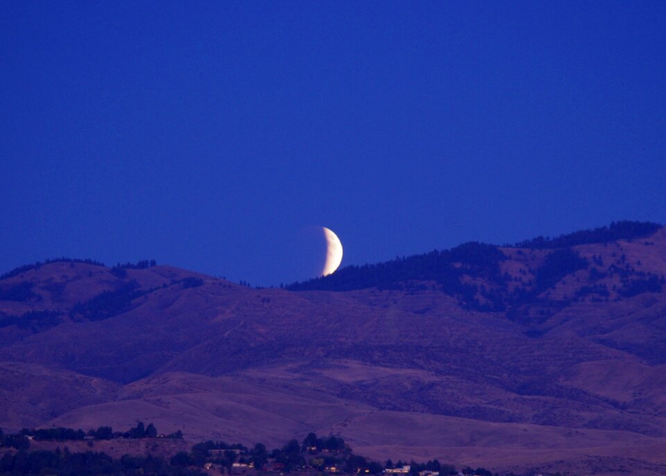 Rising night sky supermoon
