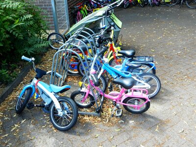Children wheel by bike photo