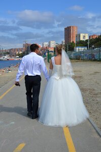 The groom bride stroll photo