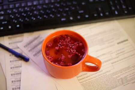 Workplace orange cup fruit tea photo