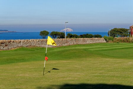 Golf flag green sea