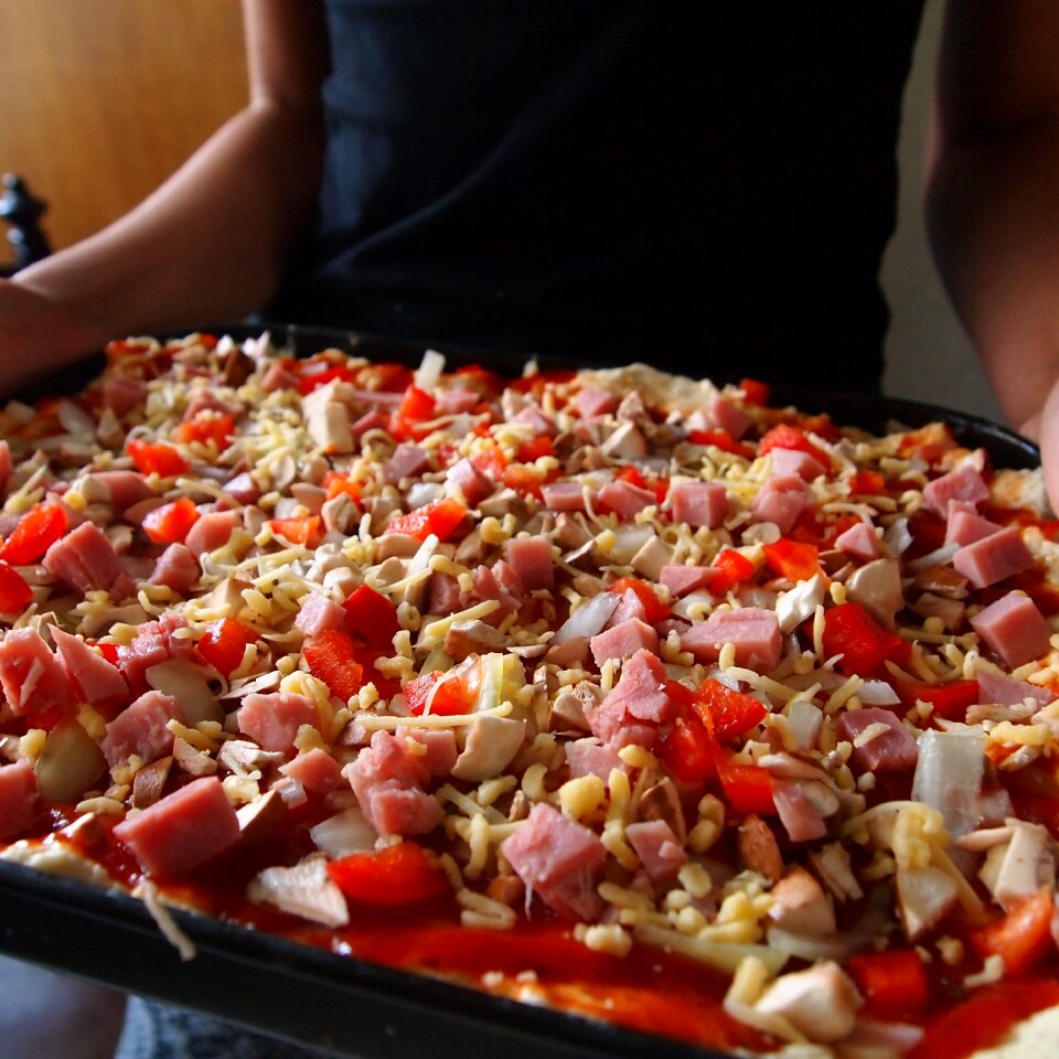 Fresh pizza baking pan stick