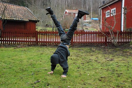 Boy backyard standing on hands