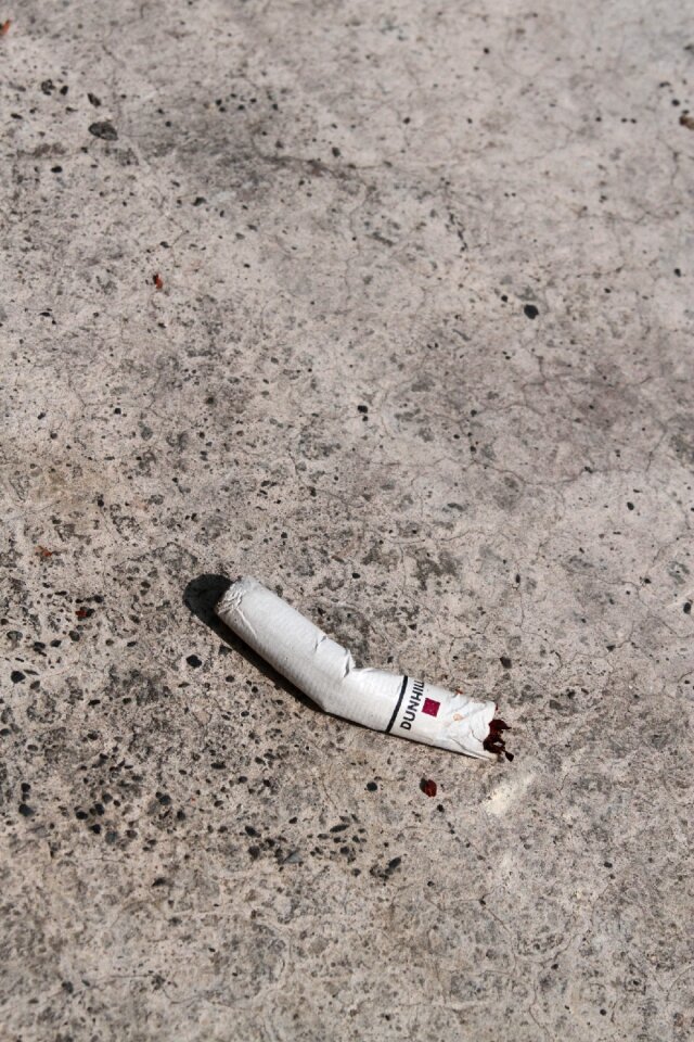 Cigarette butts concrete floor litter anywhere