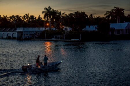 Sunset boat people photo